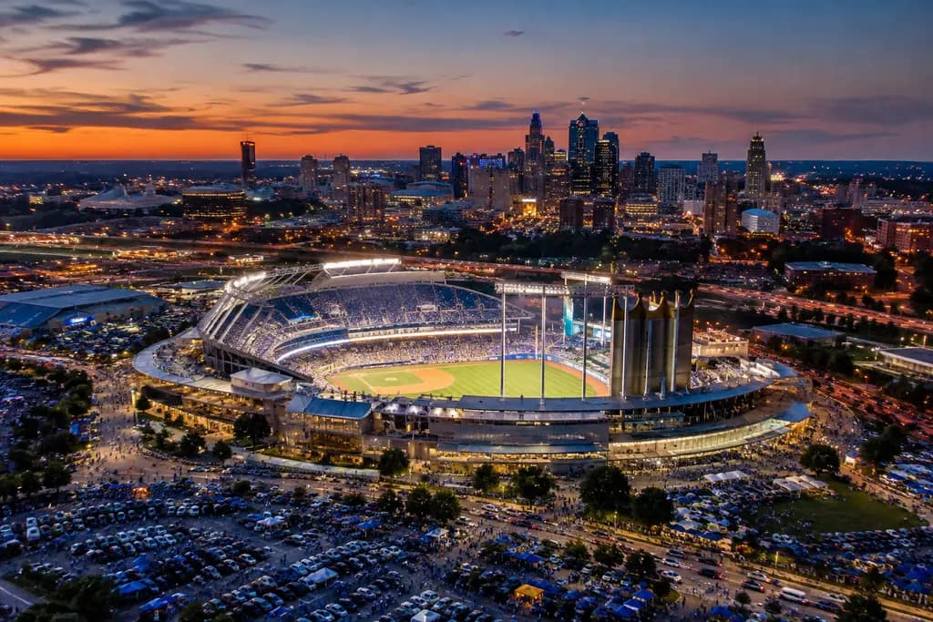 Royals stadium funding discussion with a baseball venue model and city budget papers